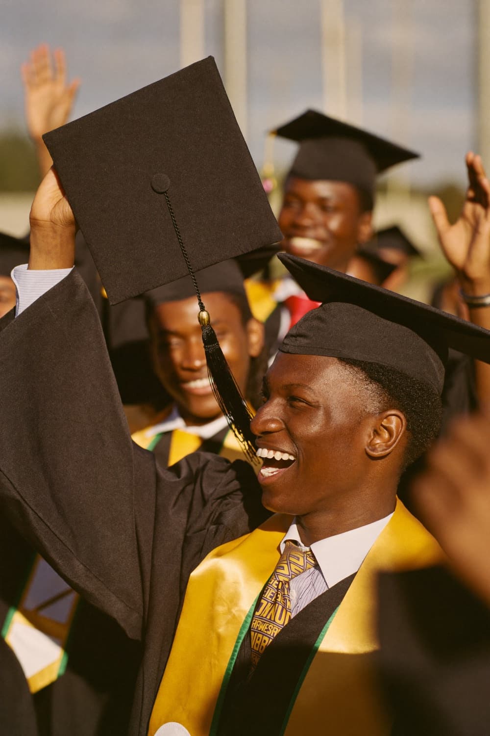 Graduates celebrating in caps and gowns